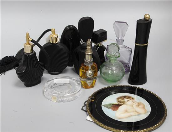 A collection of modern eau de parfum bottles, scent bottles and atomisers, some in Art Deco style